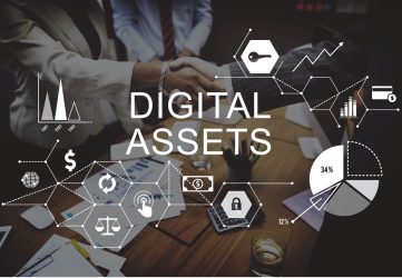 Two businesspeople shake hands over a table while another looks on. An overlay with symbols relating to finance and technology reads “DIGITAL ASSETS.”